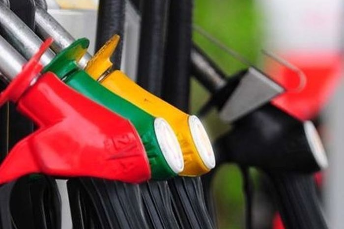 Red, green and yellow petrol pumps