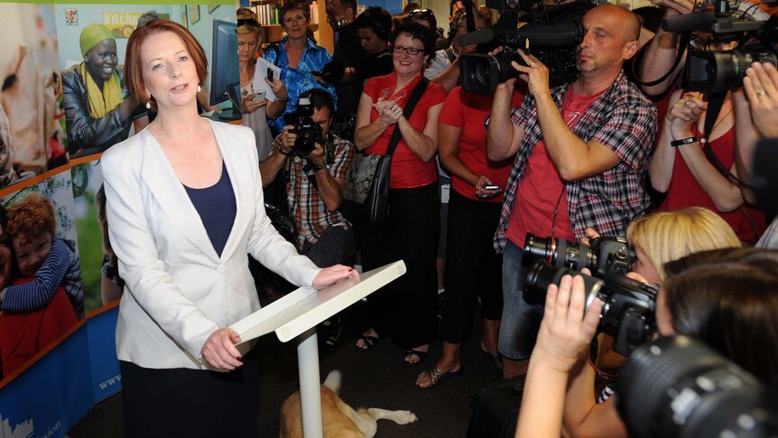 Julia Gillard fronts the media throng at a function at the Melbourne City Mission