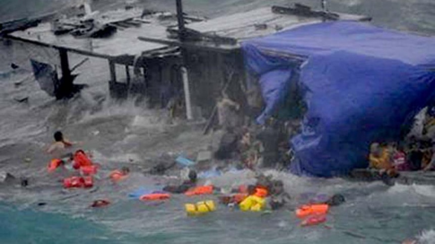 Asylum seekers float in rough surf (Supplied)