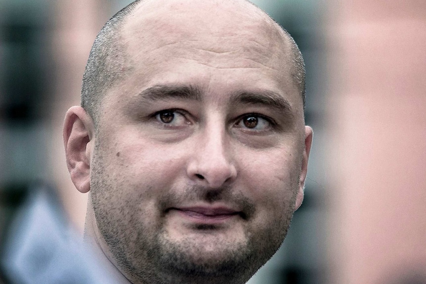 A close up of the face of Arkady Babchenko.