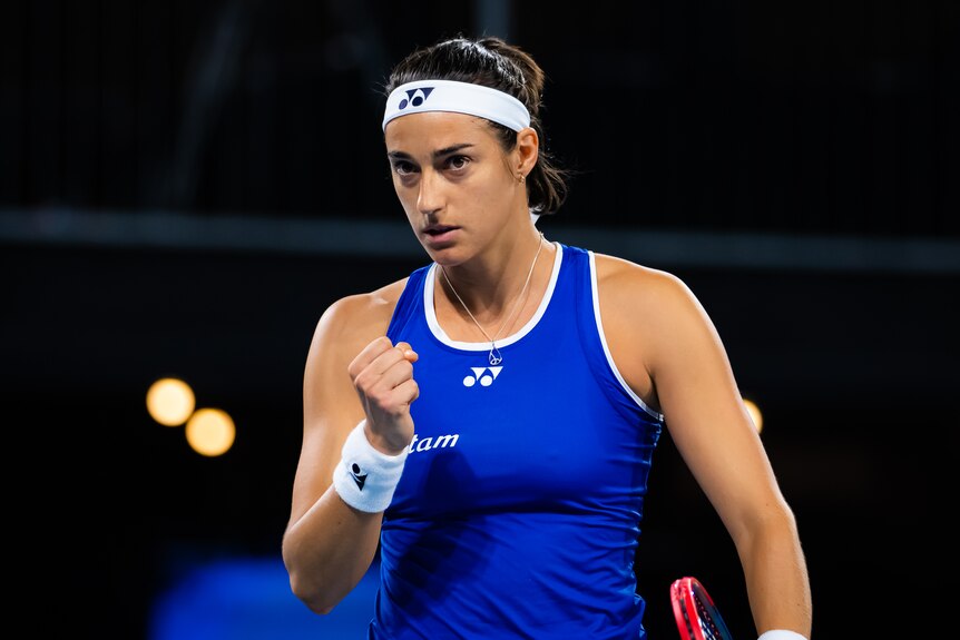 Caroline Garcia clenches her fist and looks up
