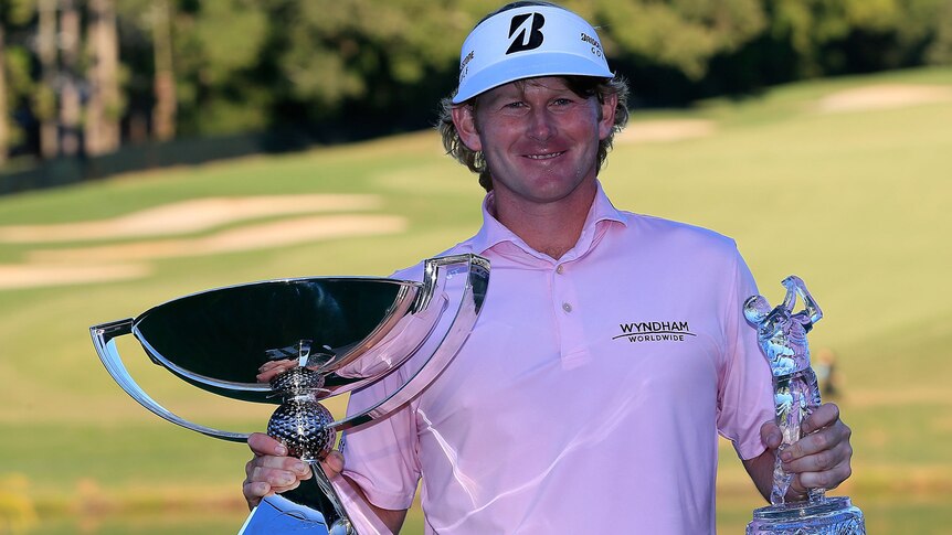 Snedeker shows off his two trophies
