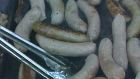 Sausages being cooked on a BBQ