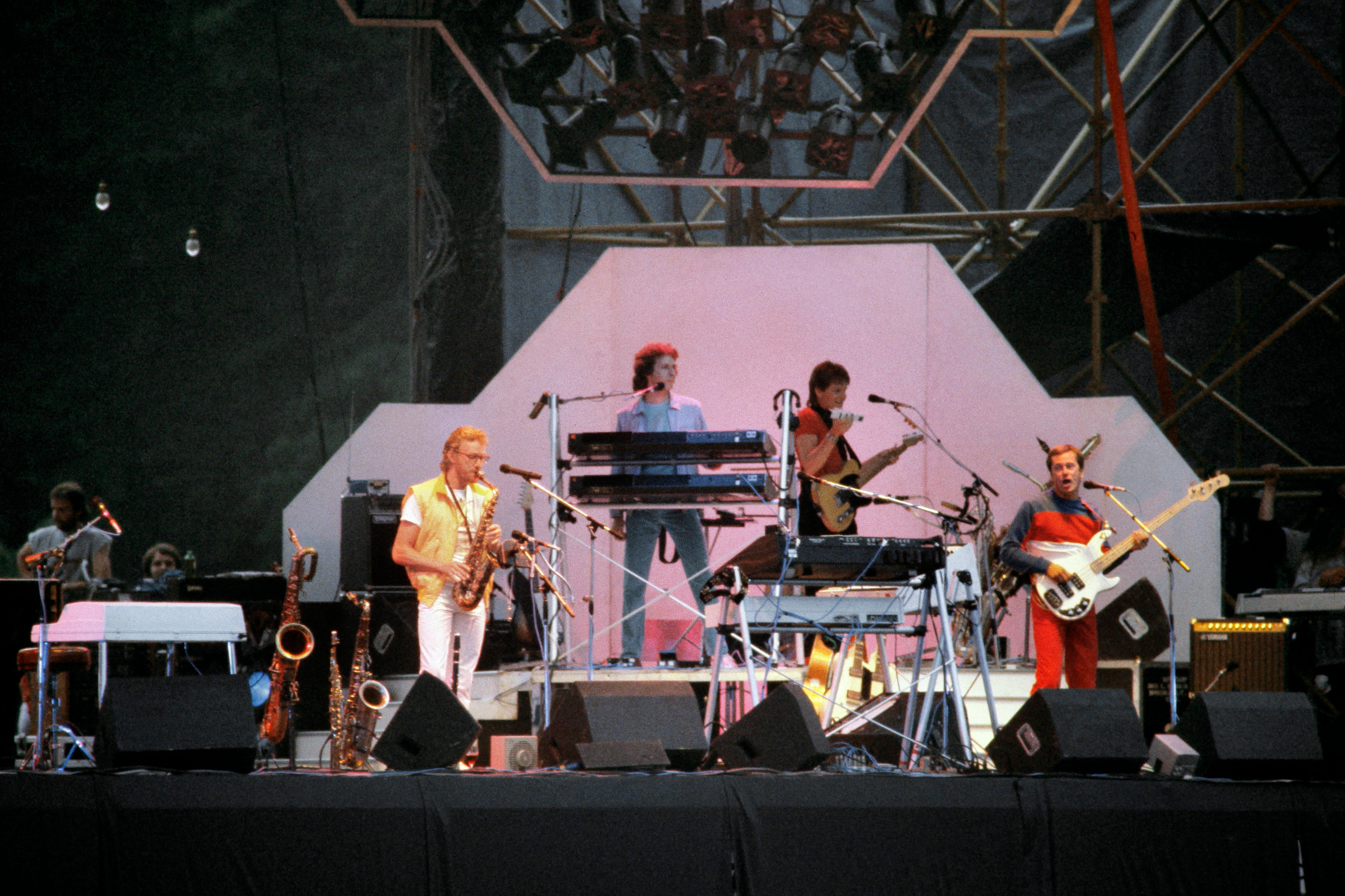 A band performs together on a stage