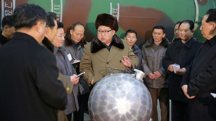North Korean leader Kim Jong-un speaks with scientists about nuclear arsenal