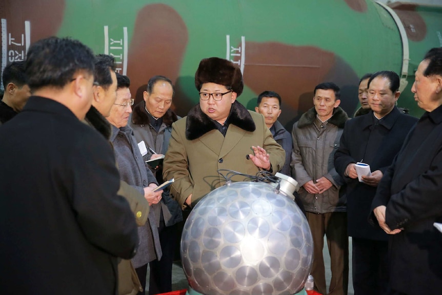 North Korean leader Kim Jong-un speaks with scientists about nuclear arsenal