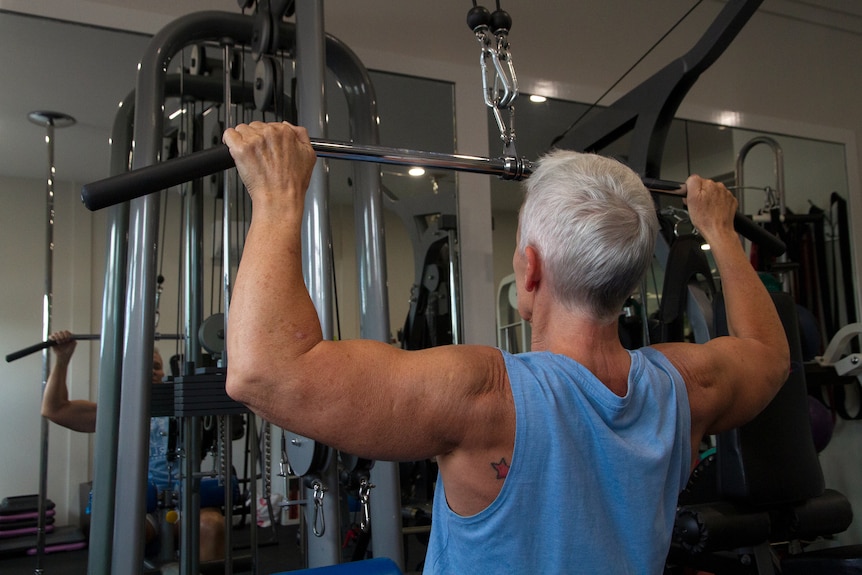 Bev Francis trains on gym equipment.