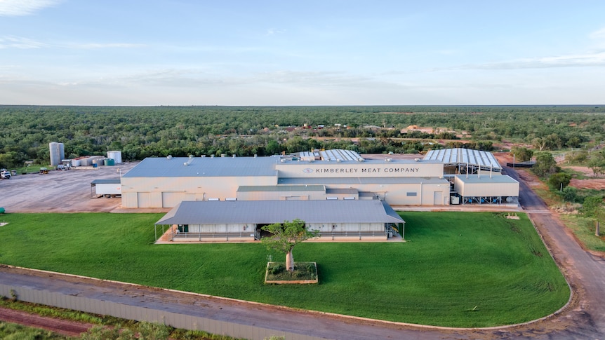 Aerial of processing facility surrounded by green grass