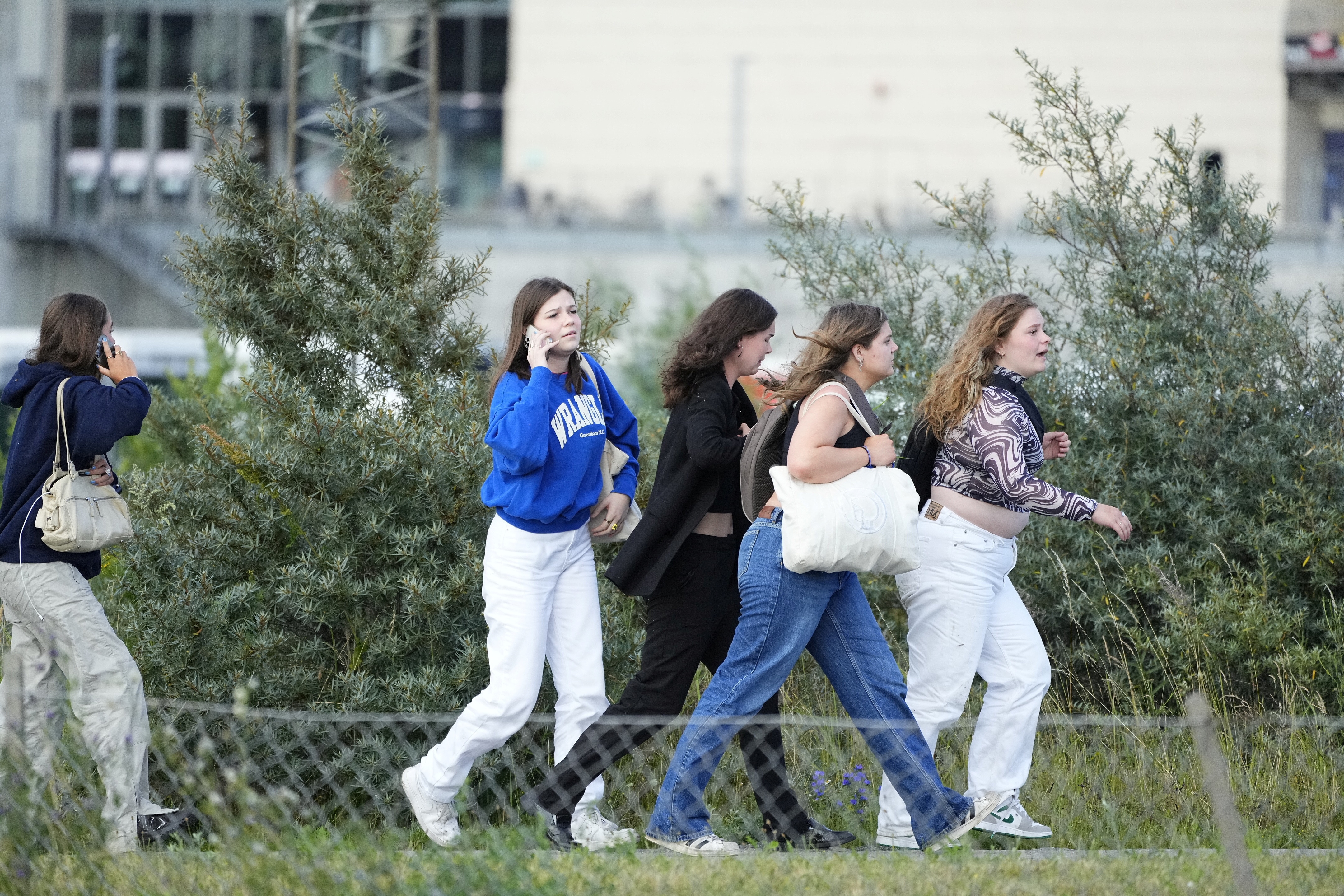 Teens run outside mall post denmark shooting