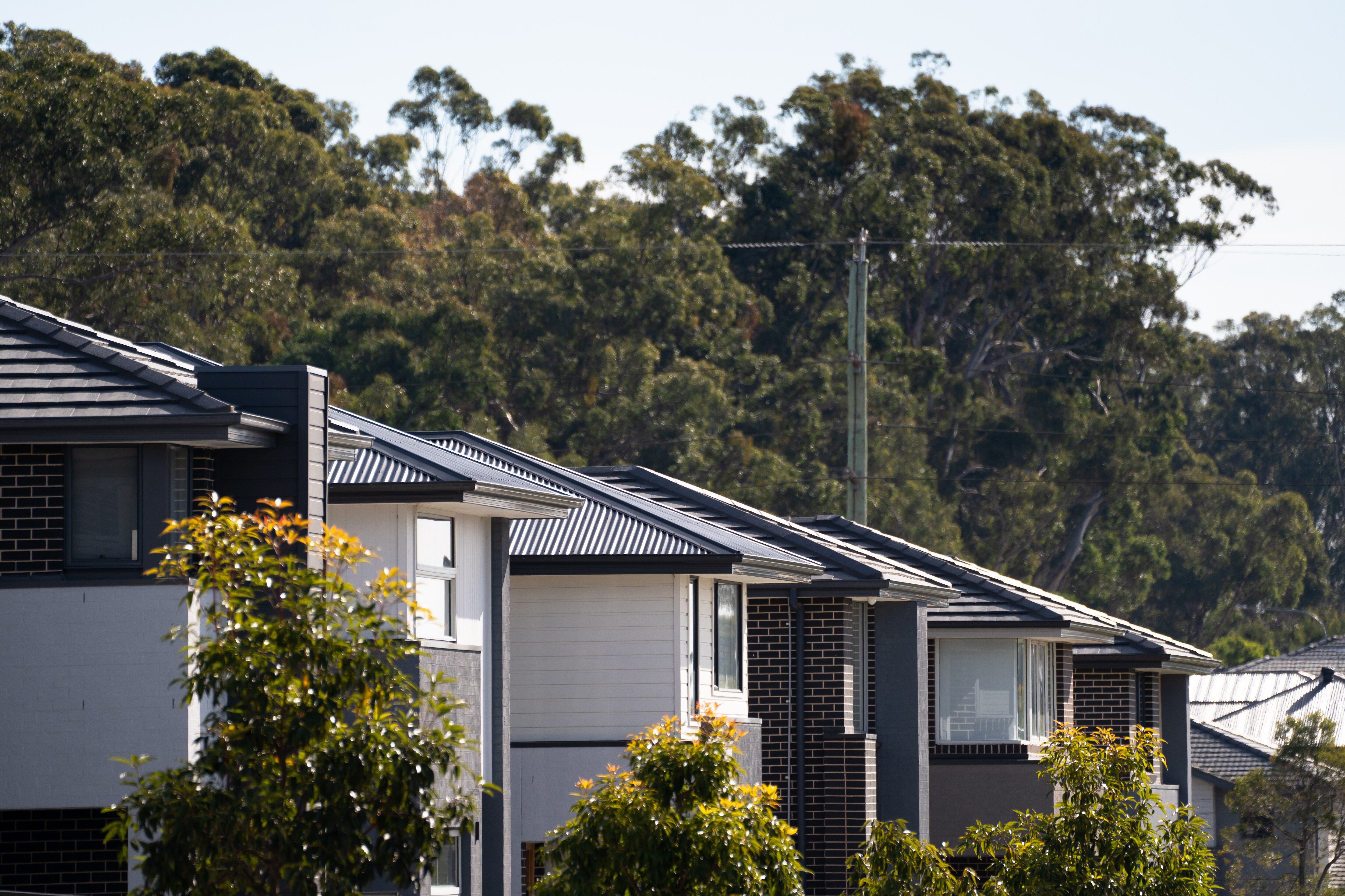 Houses under construction on a bright, sunny day