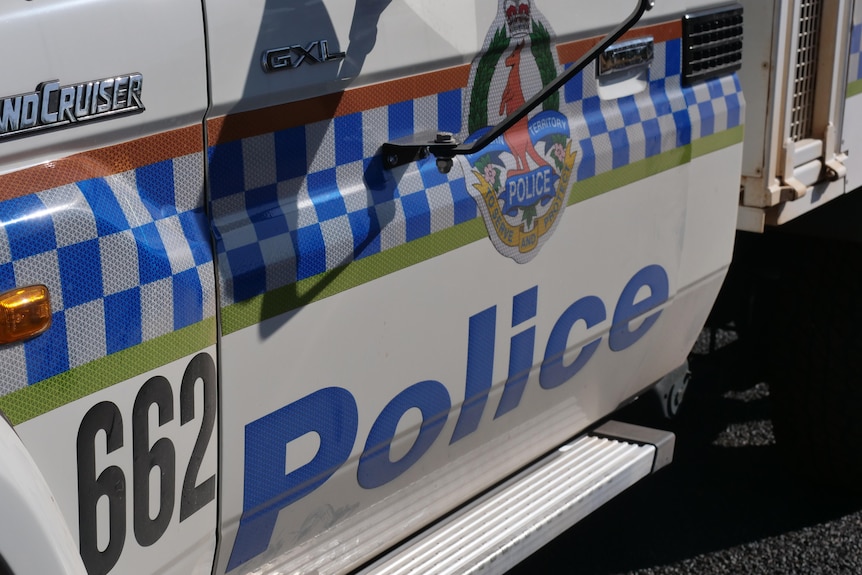 A close up of a car with NT Police branding.
