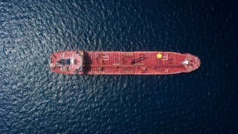 A container ship at sea, viewed from above.