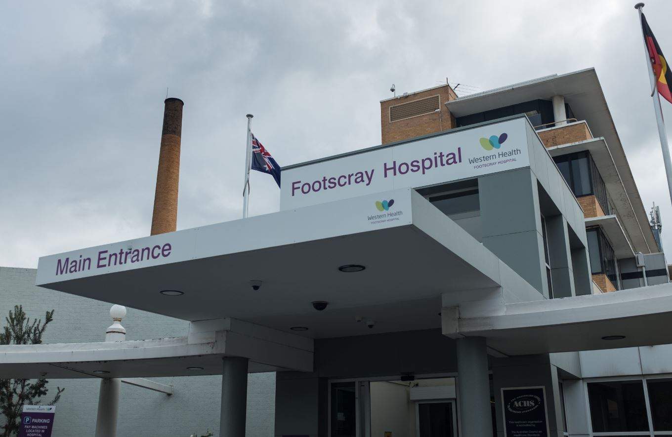The exterior of Footscray Hospital against a cloudy sky