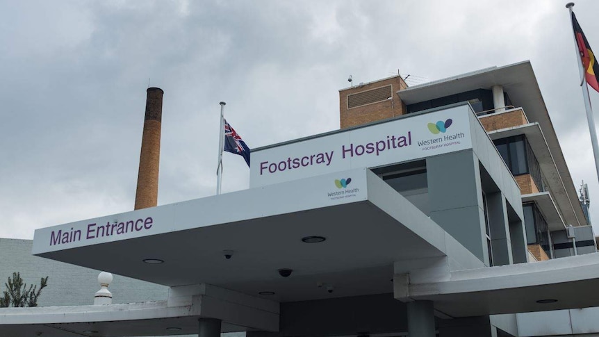 The exterior of Footscray Hospital against a cloudy sky