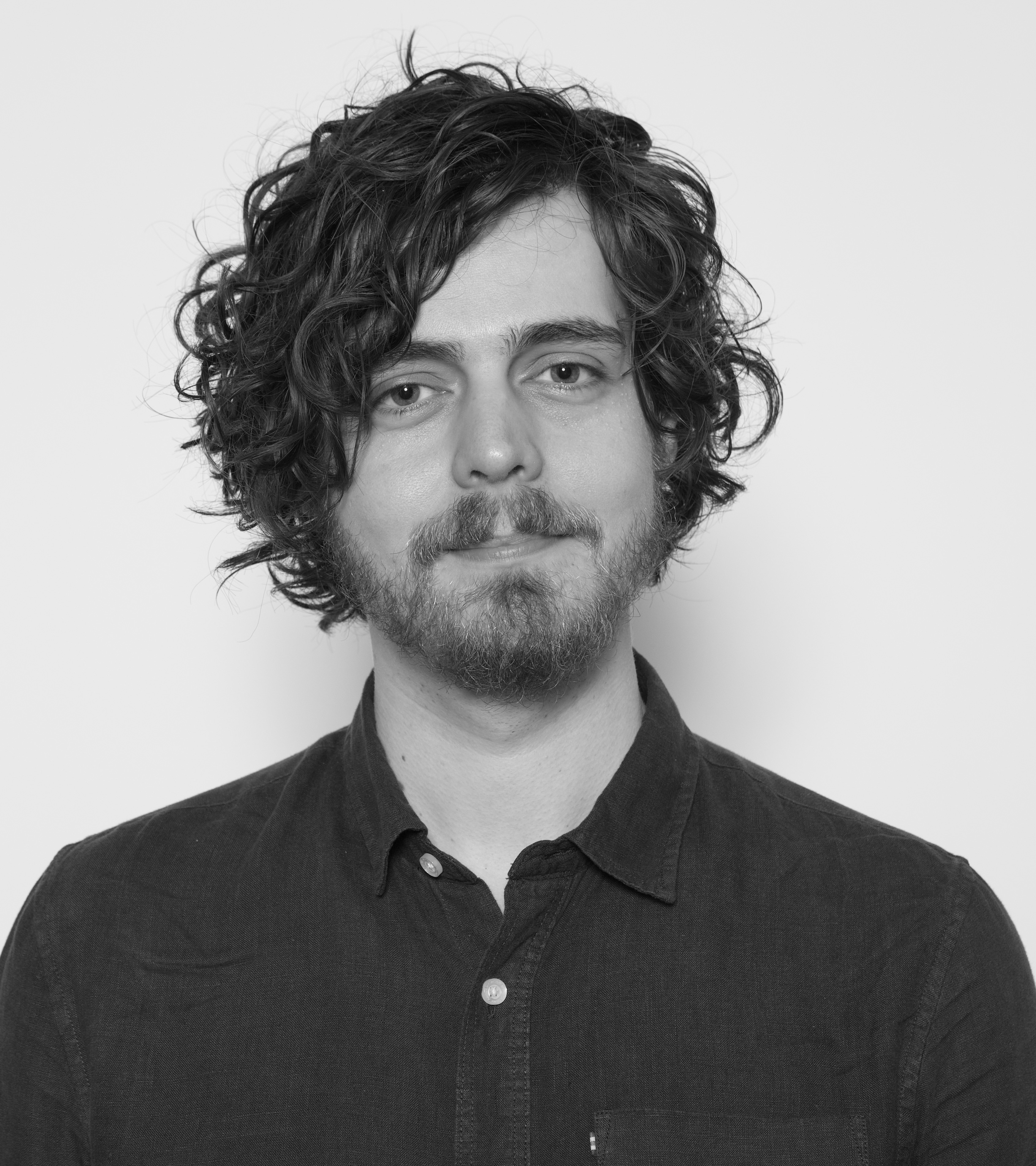 Black and white image of Steffen Herff looking directly into the camera. 