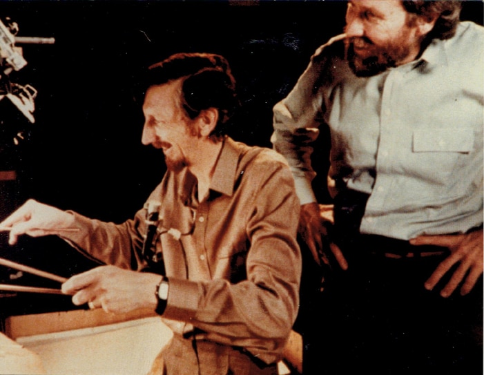 Jim Henson looks over Richard Bradshaw's shoulder while filming World of Puppetry.