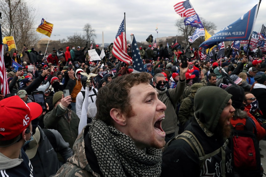 Close up of face of man shouting in a crowd of pro-Trump rioters at the US Capitol in Washington