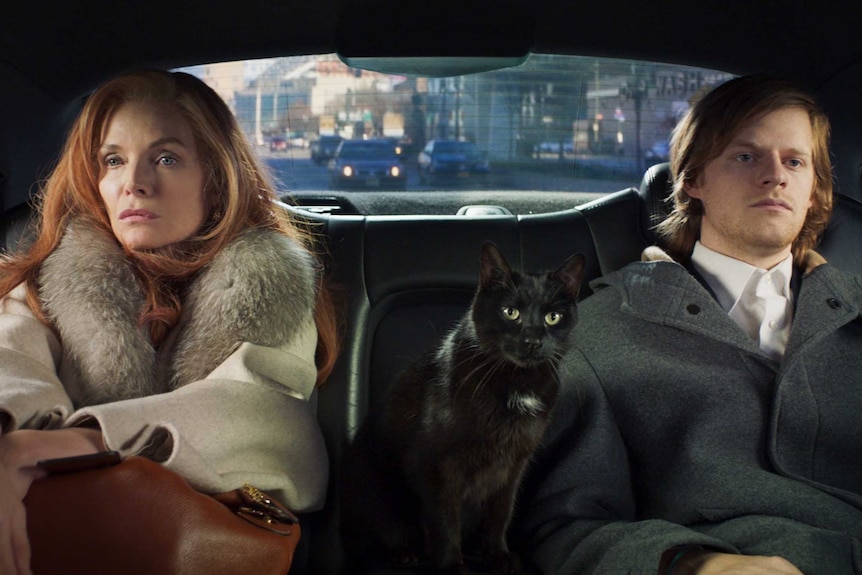 A scene from the film French Exit with Michelle Pfeiffer and Lucas Hedges as a mother and son in the back of a car with a cat