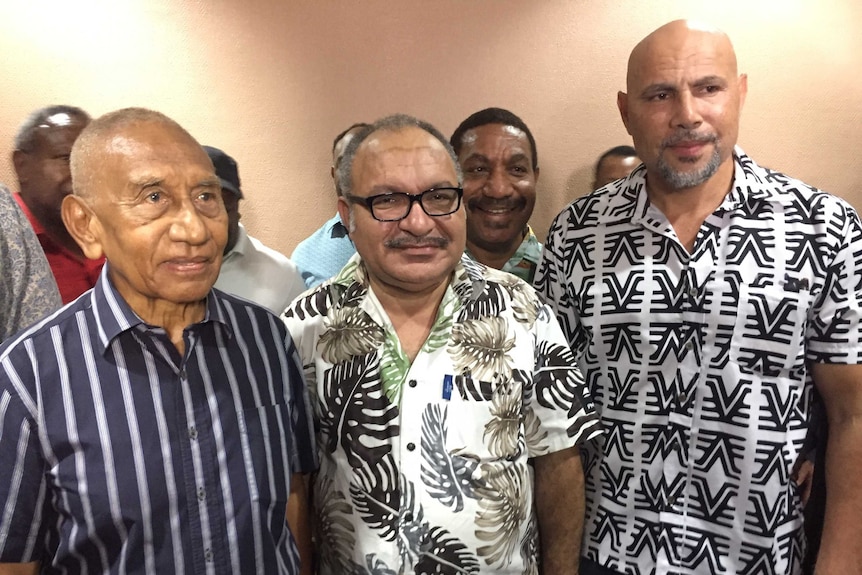 Sir Julius Chan, Peter O'Neill and Charles Abel stand next to each other.