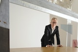 Martin Boyce poses for a photograph with his Turner Prize-winning work, Do Words Have Voices.