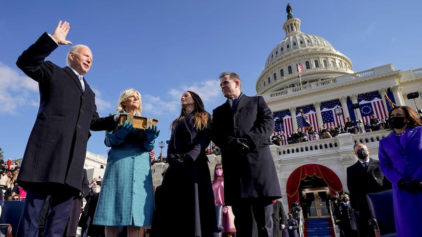 Joe Biden, Jill Biden, Ashley Biden and Hunter Biden stand outside the US Capitol building on a bright, sunny day