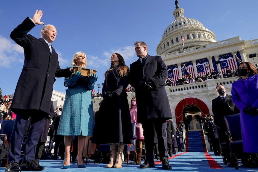 Joe Biden, Jill Biden, Ashley Biden and Hunter Biden stand outside the US Capitol building on a bright, sunny day