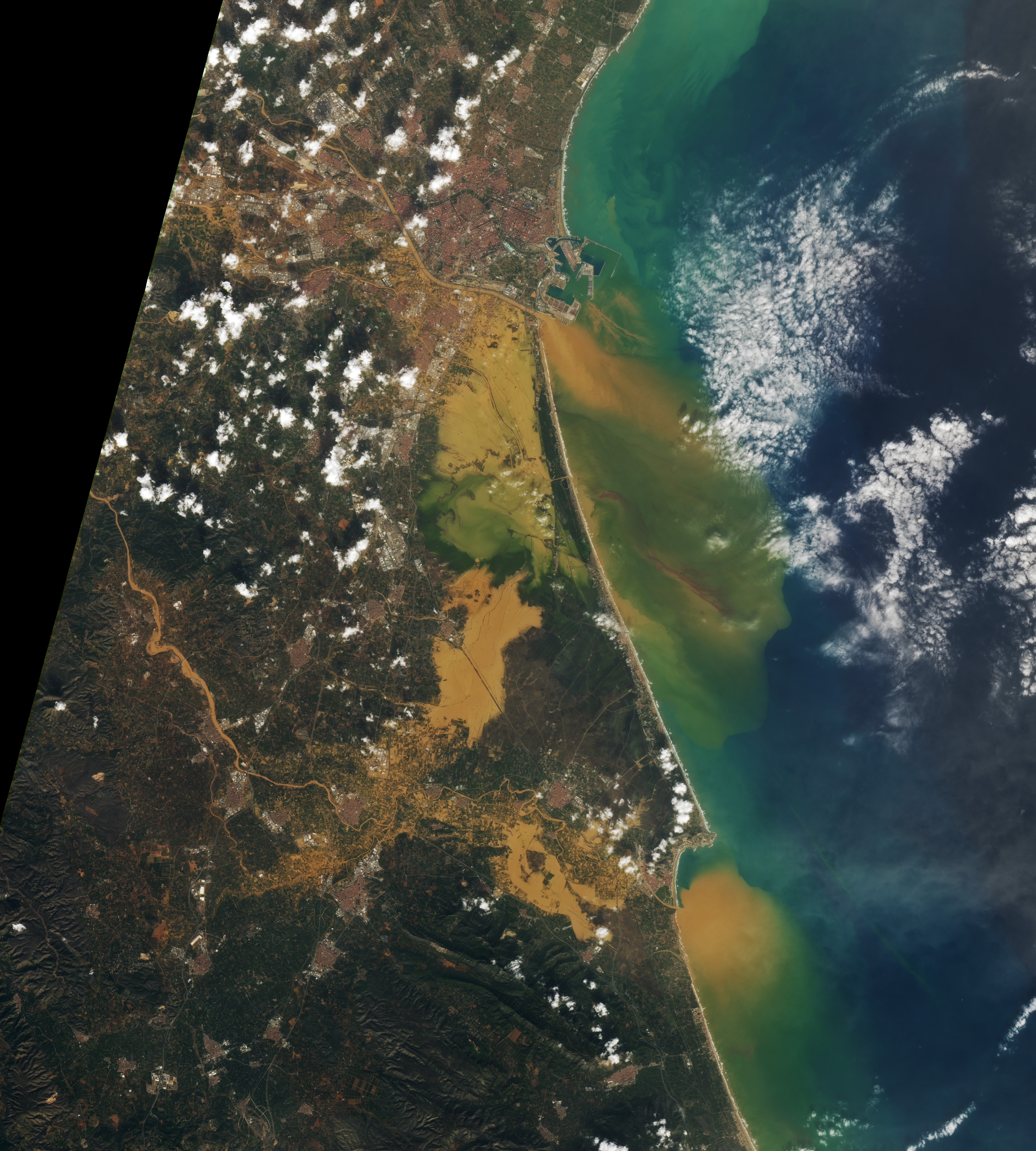 Flooding of urban and agricultural lands in and around Valencia.