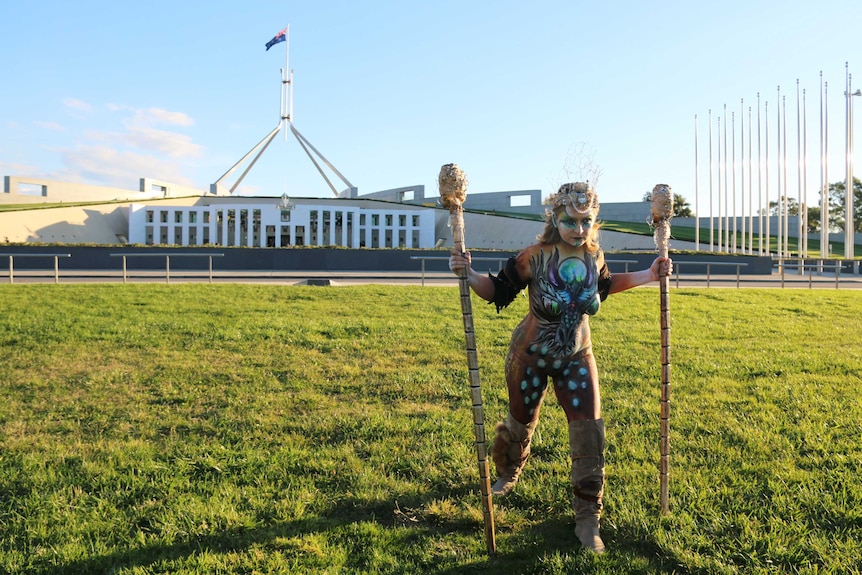 Rachelle Panitz poses for a National Breast Cancer Foundation calendar shoot outside Parliament House.