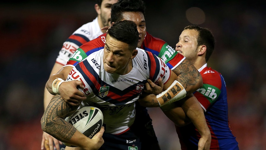 Bruising encounter ... Sonny Bill Williams is tackled by the Knights defence