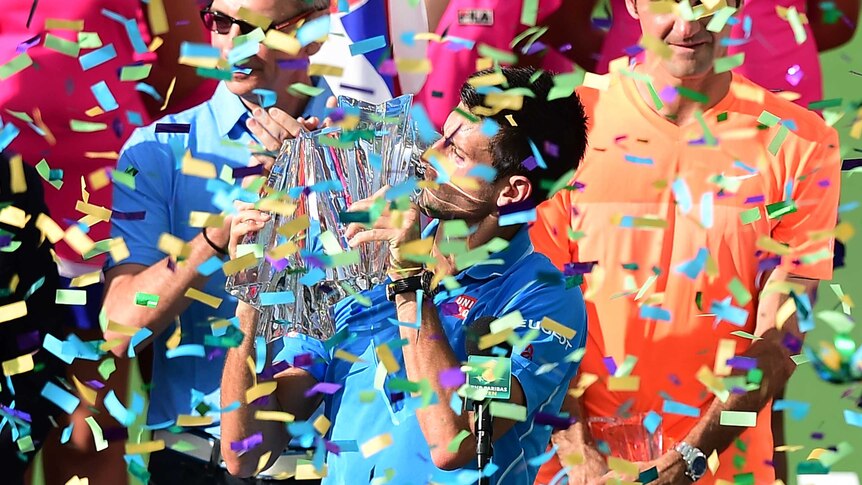 Djokovic celebrates with Indian Wells trophy