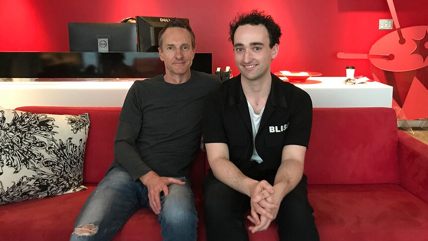 Photograph of Richard Kingsmill and Tom Purcell (Wave Racer) sitting on a couch at the triple j office.