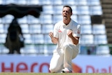 Australia's Steven O'Keefe celebrates Sri Lanka's Kaushal Silva's wicket in the first Test.