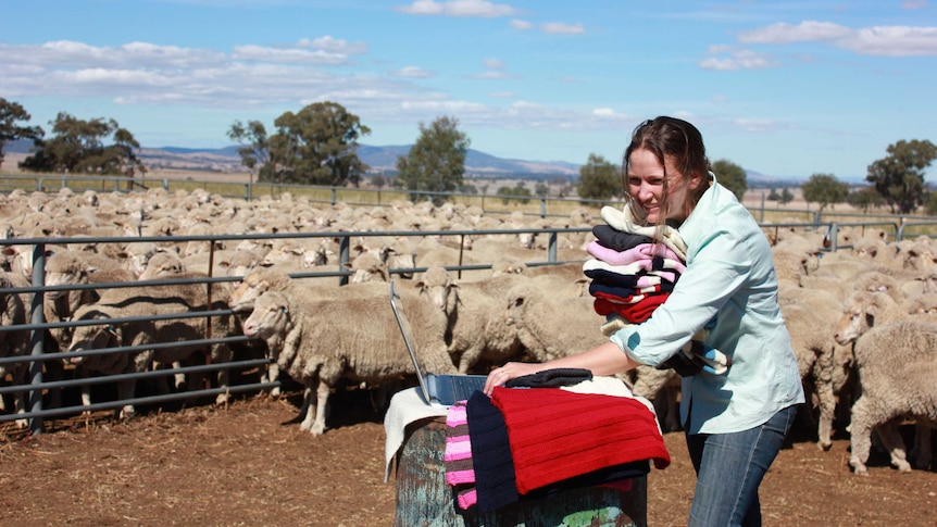 Annabel Scott juggles knitted goods and a lap top on the family farm.