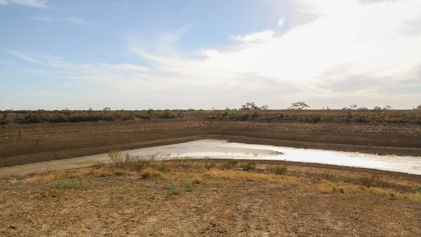 A wide shot of the drying Murray Macmillan dam