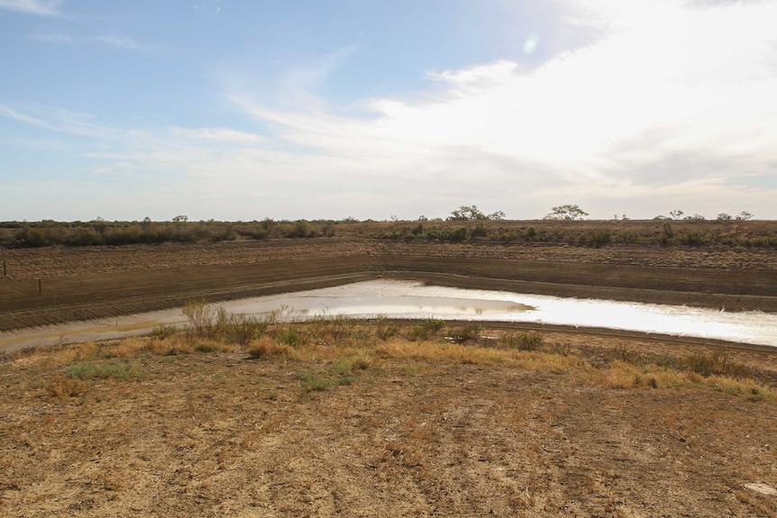 A wide shot of the drying Murray Macmillan dam