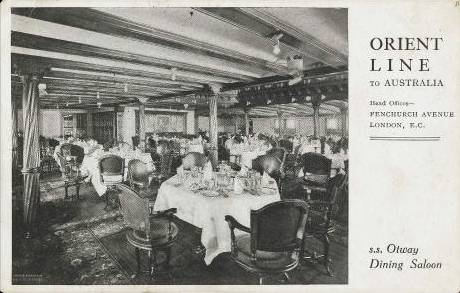A black and white photo of an ocean liner first class dining room 