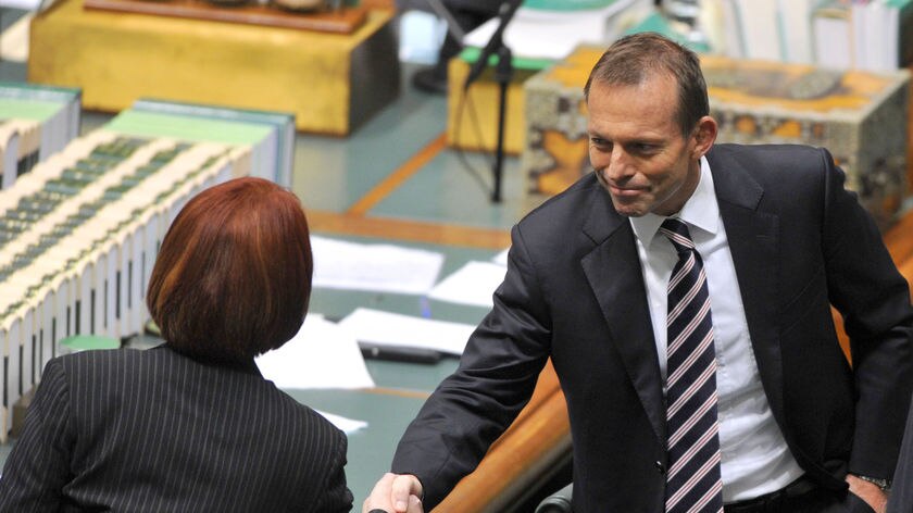 Tony Abbott has offered to talk compromise with Julia Gillard.