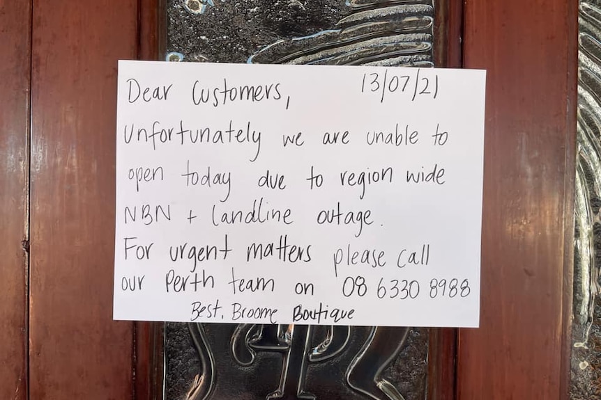 a paper sign on a door tells customers a business will not be opening due to no internet