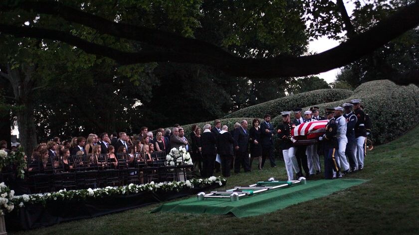 Final farewell: The Kennedy family mourns at the grave site.