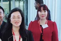 Two women in the corridors of parliament house.