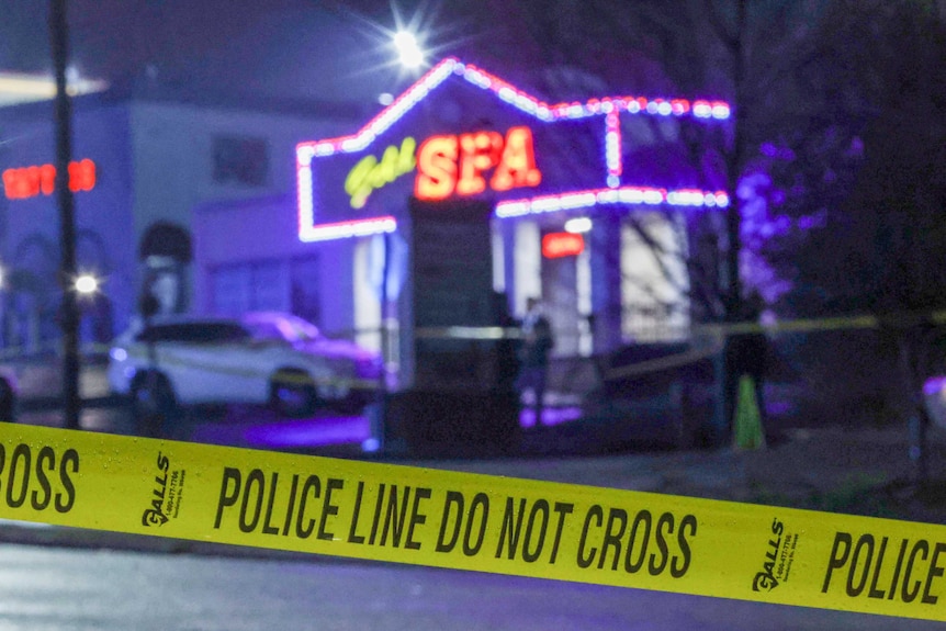 Police tape erected in front of a massage parlour