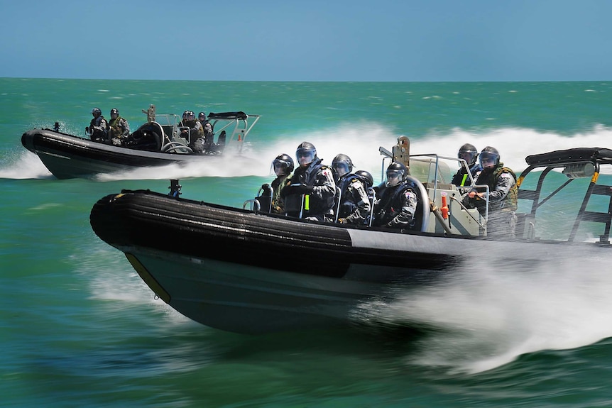 Attack One personnel from HMAS Albany proceed to a simulated suspected irregular entry vessel (SIEV) during a training exercise.