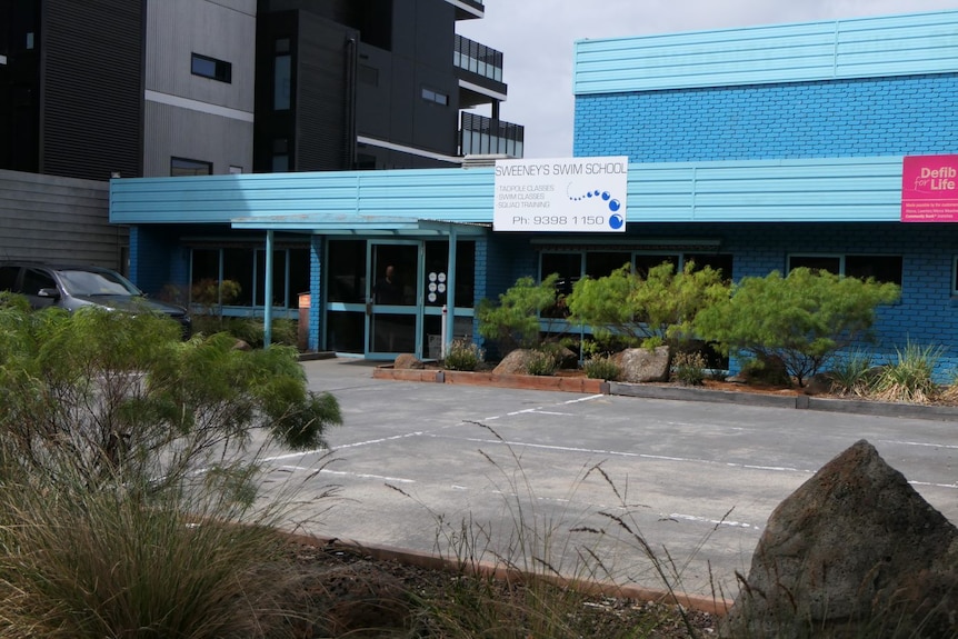 The bright blue outside of a learn to swim school