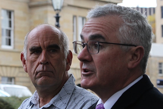 James Boyce and Andrew Wilkie holding a press conference outdoors in Hobart.