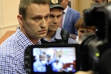 Alexei Navalny appears in court in Kirov, where he was sentenced to five years in prison.