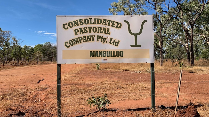 a sign for Manbulloo Station.