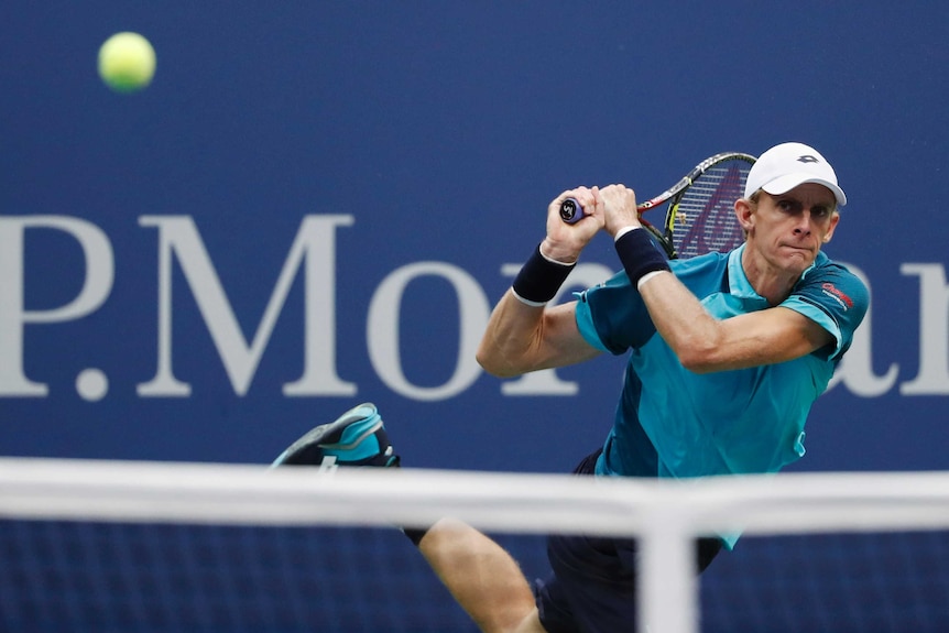 Kevin Anderson plays a backhand in the US Open final