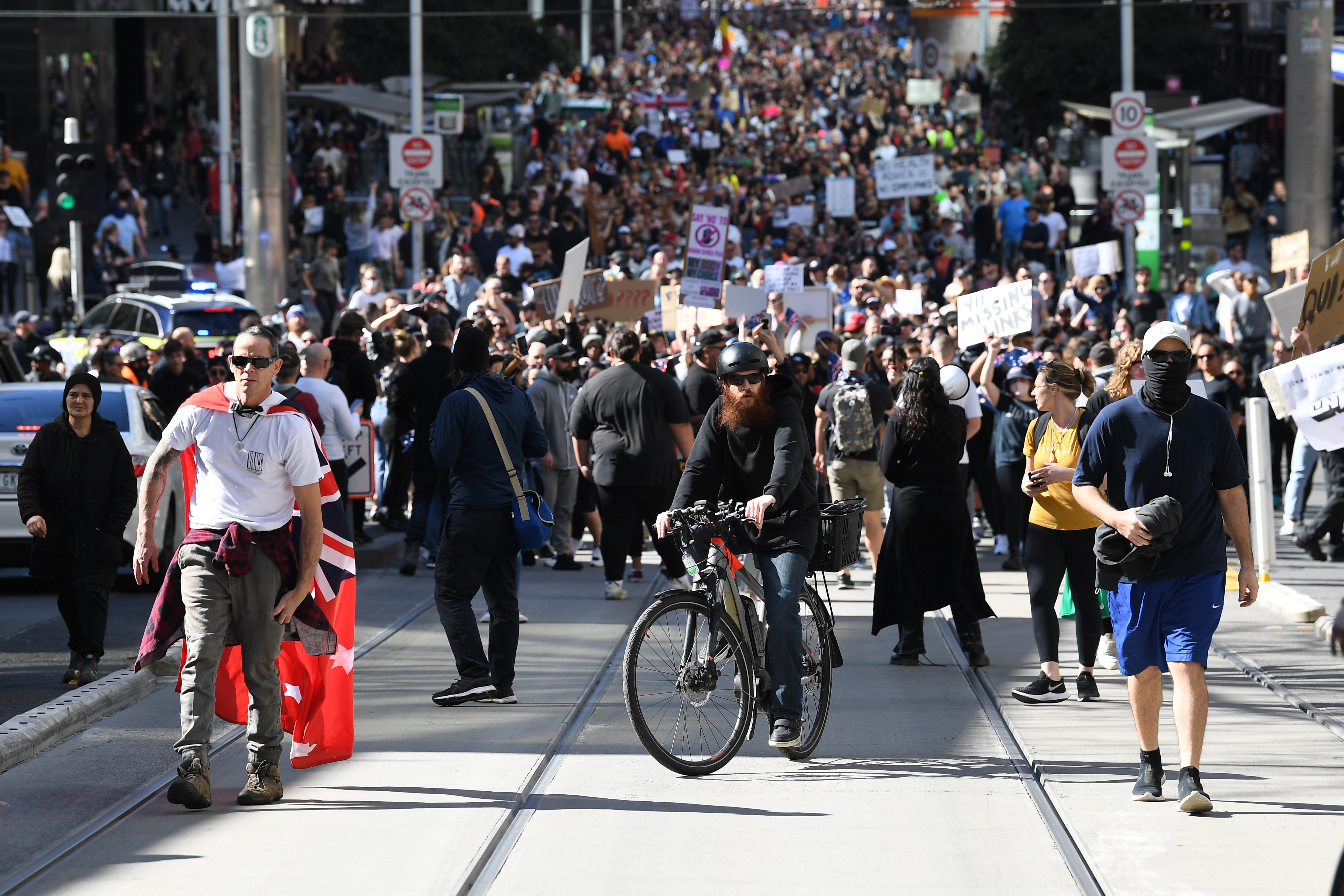 Antilockdown protesters clash with police in Melbourne, smaller