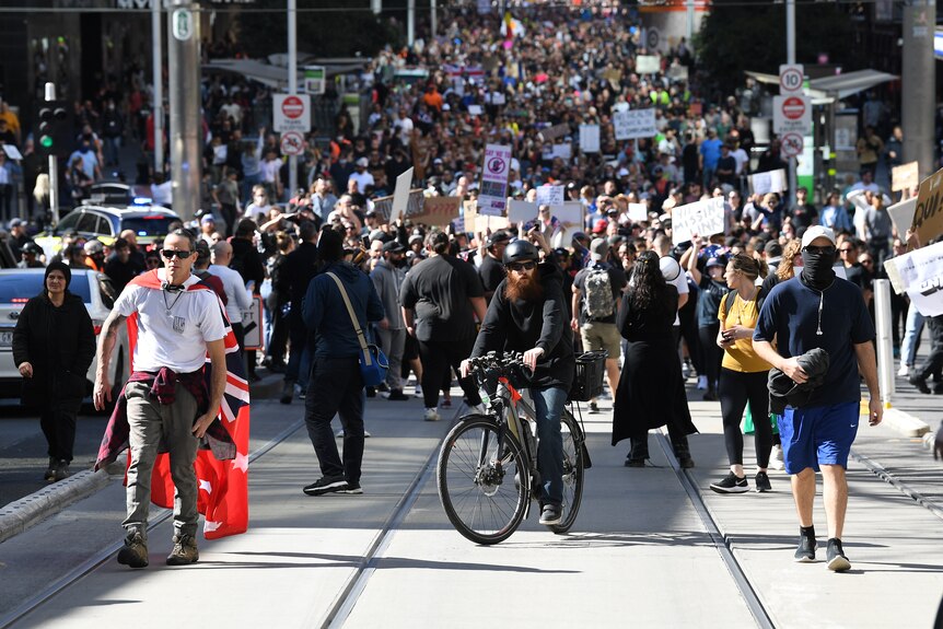 Protesters are seen during an anti-lockdown protest in the central business district of Melbourne.
