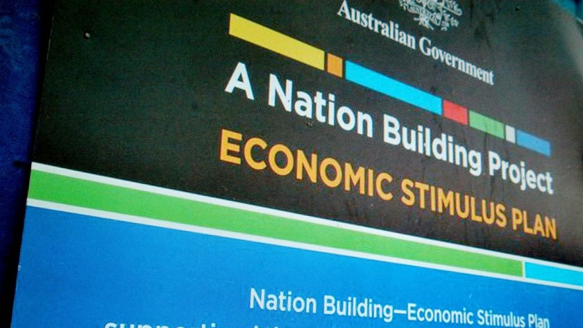 A sign stating that a building project is part of the Rudd Government's economic stimulus